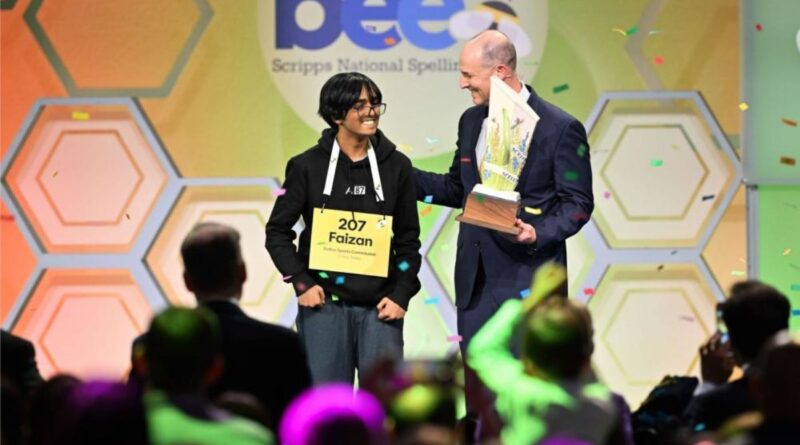 13-year-old Faizan Zaki celebrates winning the 2025 Scripps National Spelling Bee on stage with confetti in the background