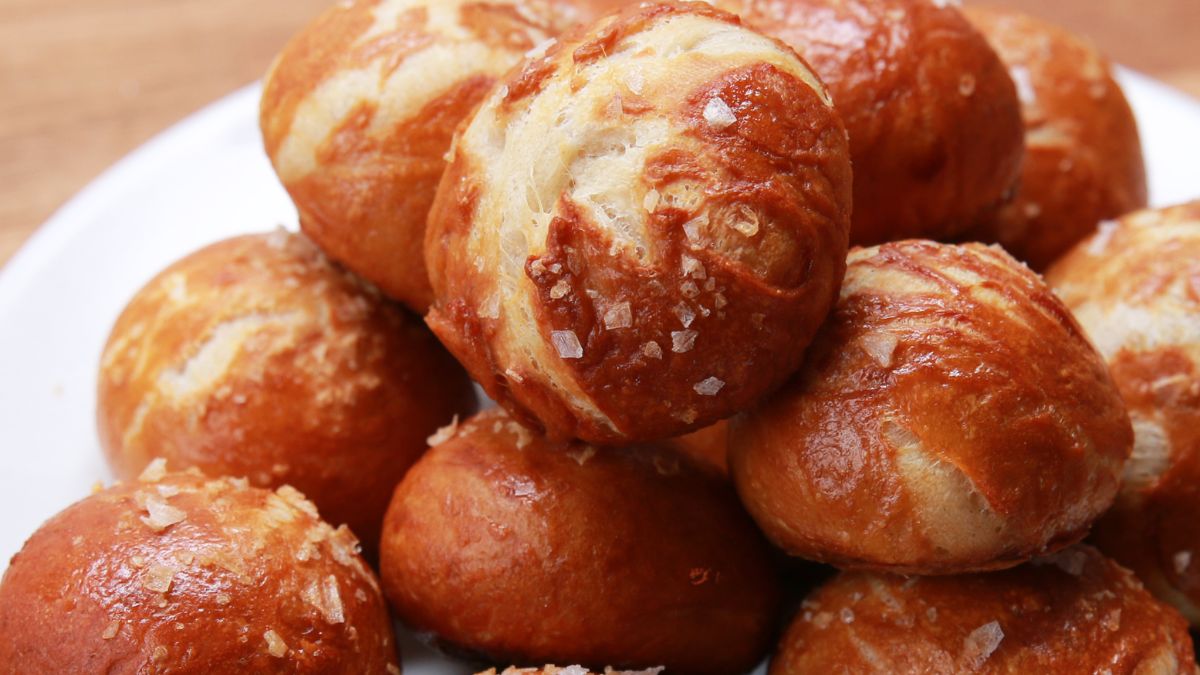Golden pretzel bites sprinkled with coarse salt, served with beer cheese dip