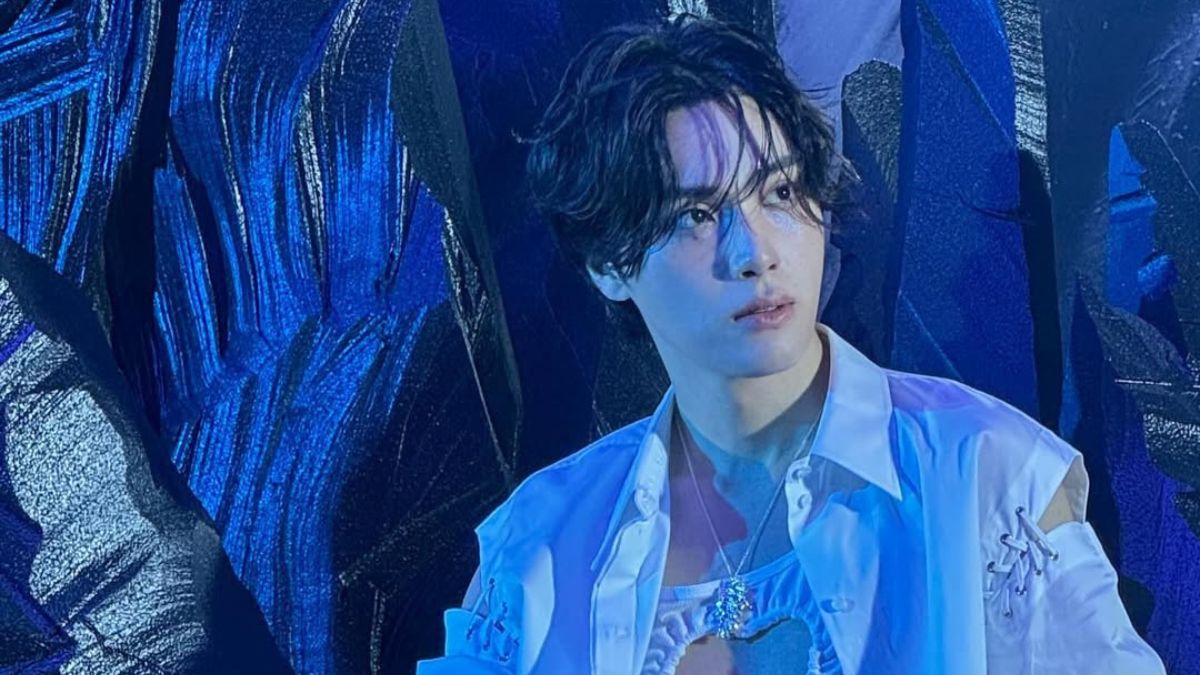 Ju Haknyeon in a reflective moment under blue lighting