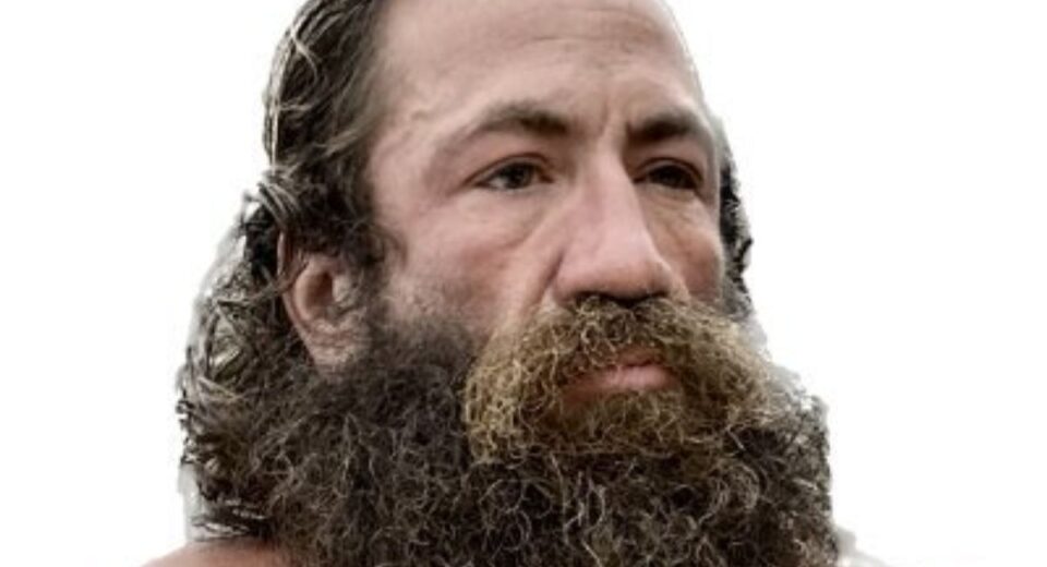 Close-up of Brian “Liver King” Johnson with rugged beard and intense expression