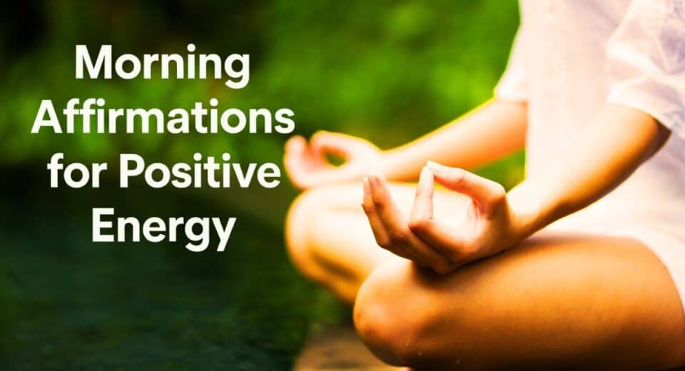 A person in a meditative pose near water with greenery, practicing mindfulness and affirmations