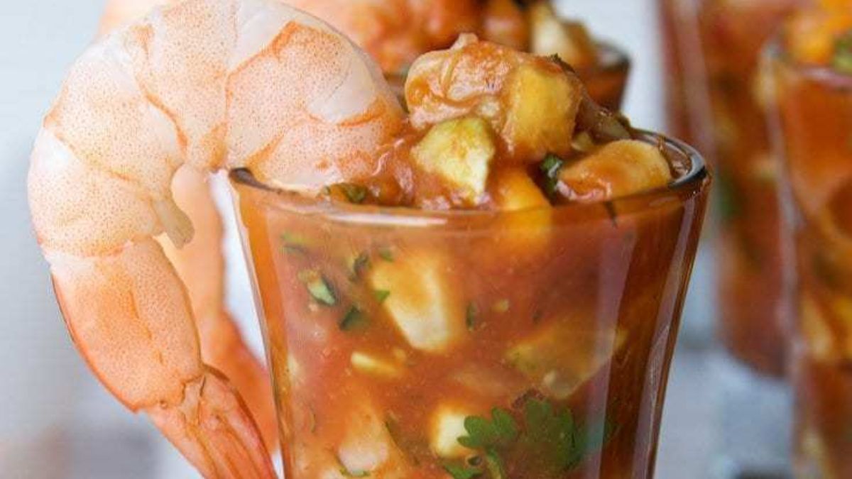 Shrimp cocktail shooters in small glasses with cocktail sauce