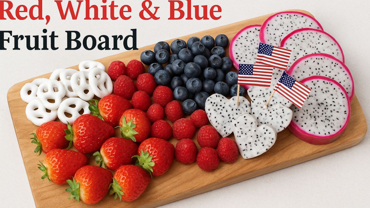 Red, white, and blue Fourth of July fruit board with strawberries, blueberries, yogurt pretzels, and dragon fruit