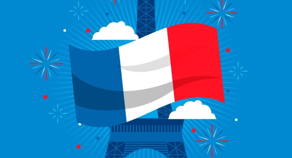 French flag waving in front of the Eiffel Tower with fireworks