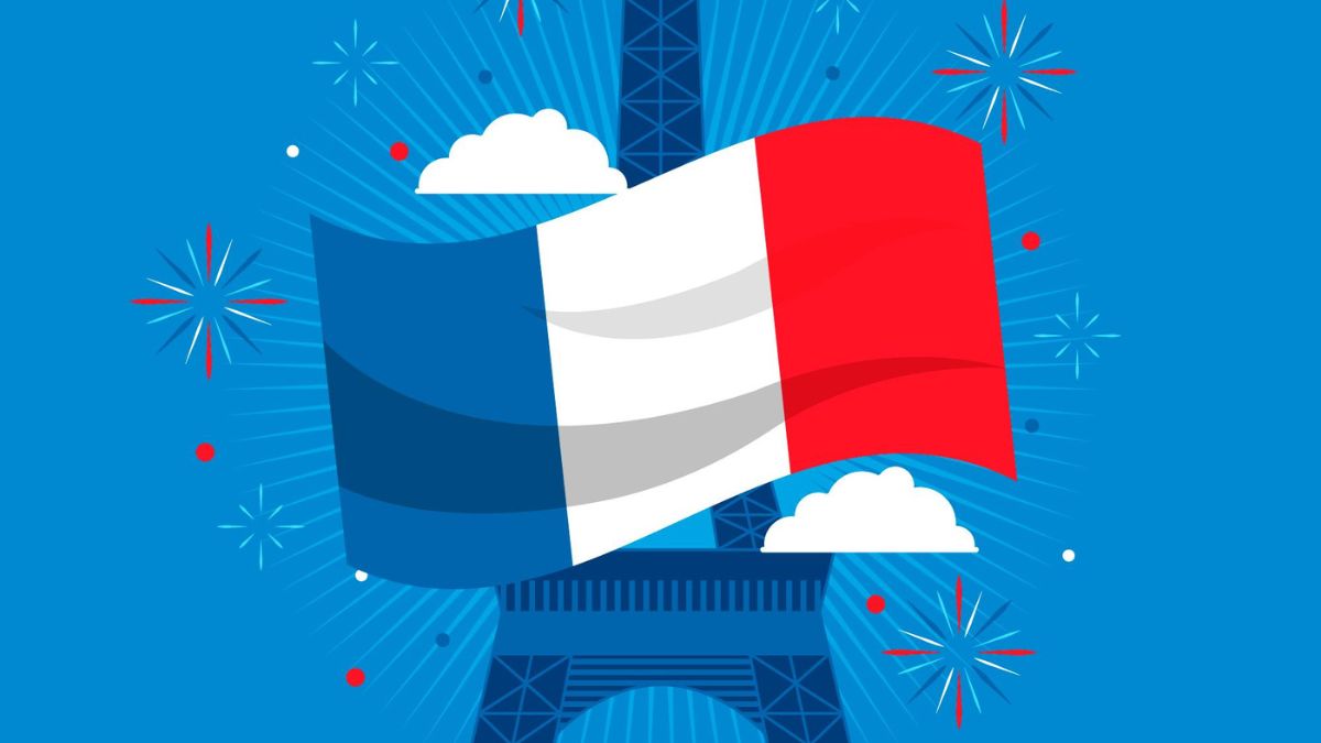 French flag waving in front of the Eiffel Tower with fireworks