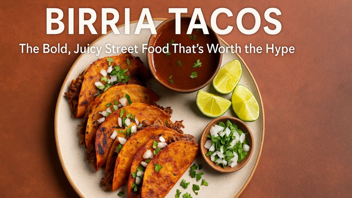 Birria tacos with consommé and lime wedges on a plate