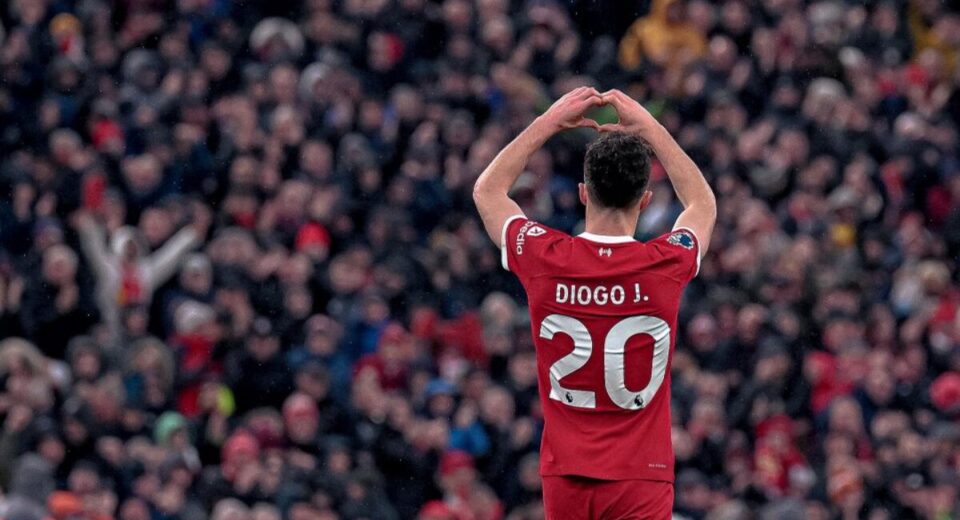 Diogo Jota makes a heart gesture to fans during a Liverpool match