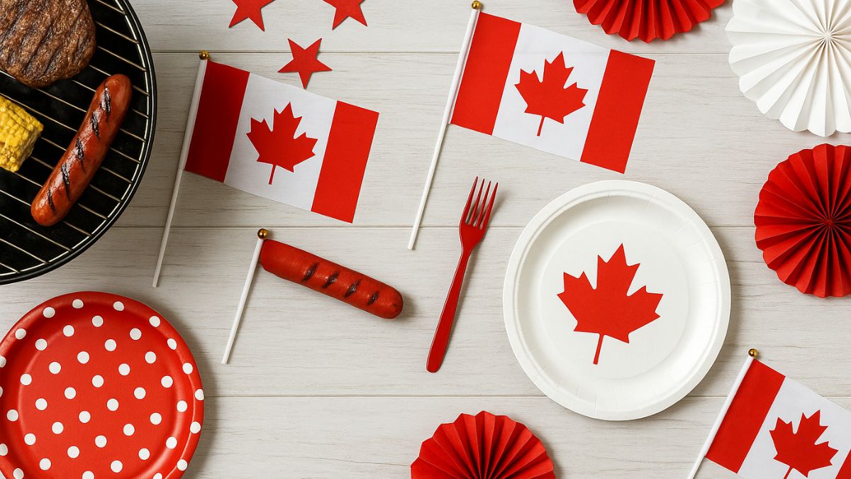 Canada Day 2025 flatlay with BBQ, flags, and red-and-white decorations