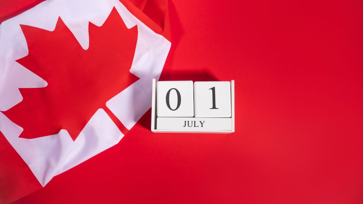 Happy Canada Day 2025 – July 1st Celebration Date Canadian flag and wooden block calendar showing July 1st for Canada Day 2025