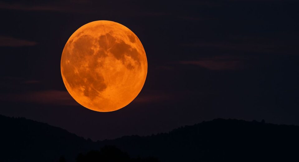July 2025 Buck Moon glowing orange during moonrise