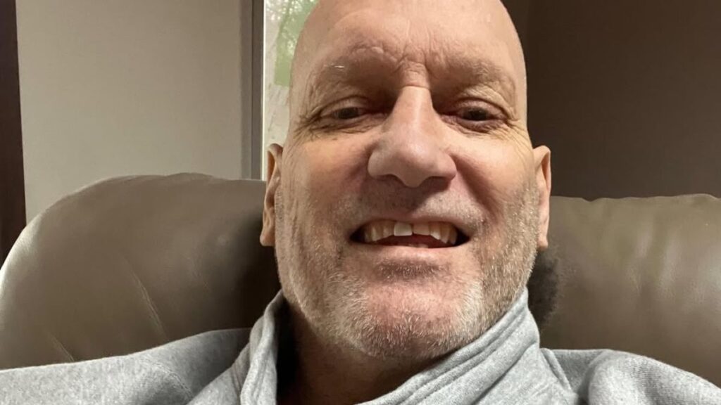 Lyndon Byers smiles while seated in a recliner during his later years