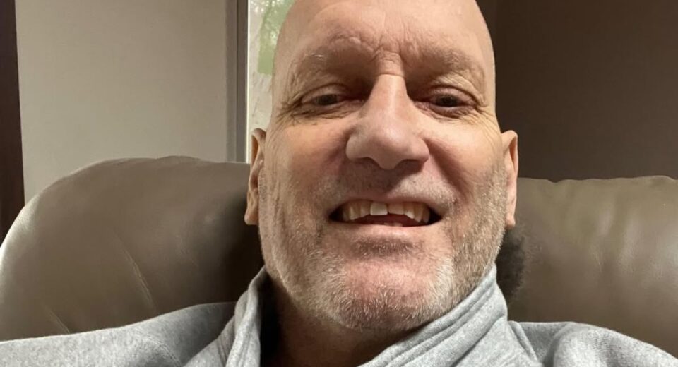 Lyndon Byers smiles while seated in a recliner during his later years