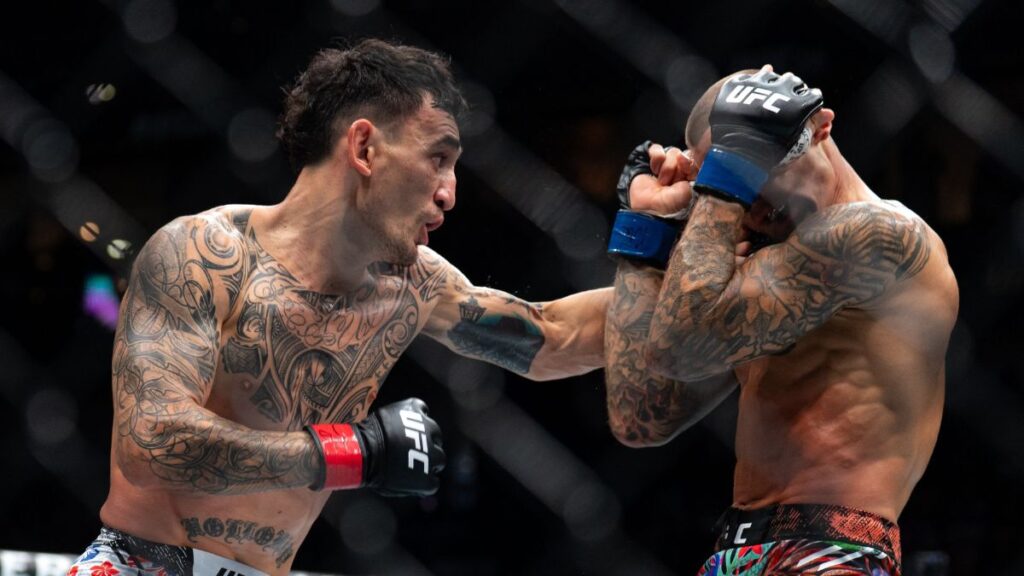 Max Holloway punches Dustin Poirier during UFC 318 main event