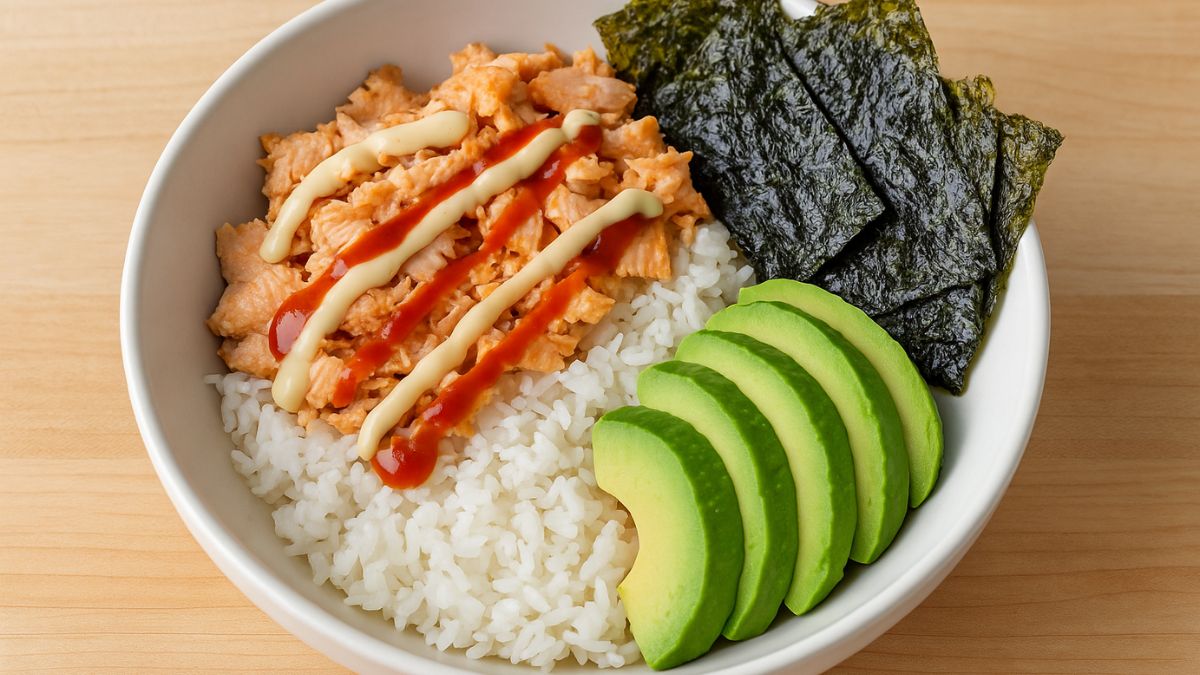 Salmon rice bowl with avocado and seaweed