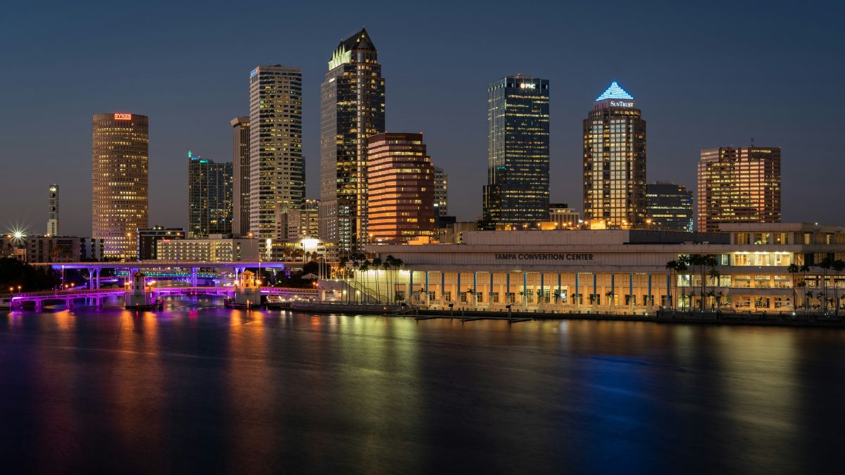 Night view of Tampa skyline with colorful reflections over the water