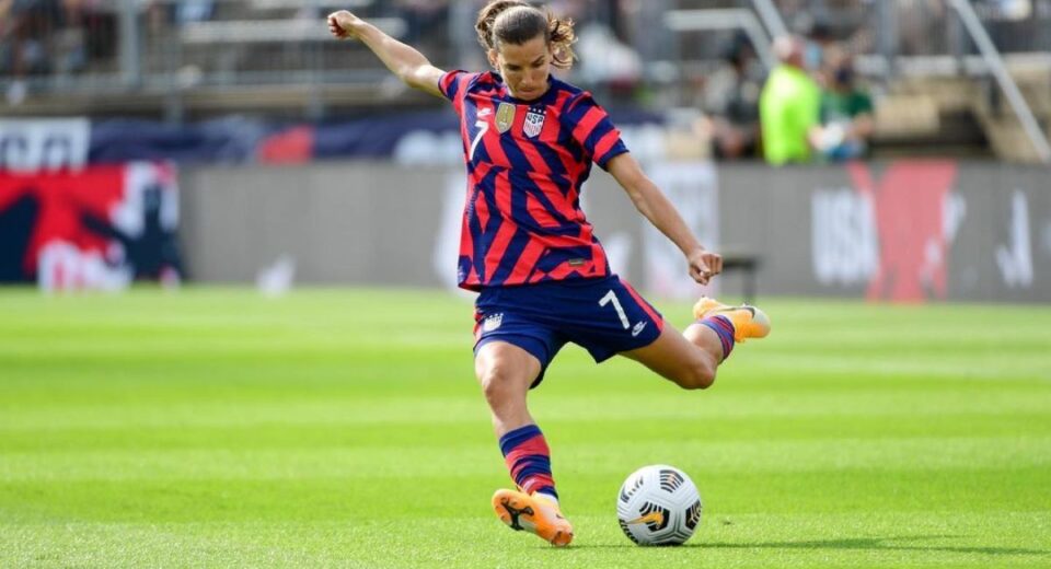 Tobin Heath of the USWNT takes a powerful shot during a match