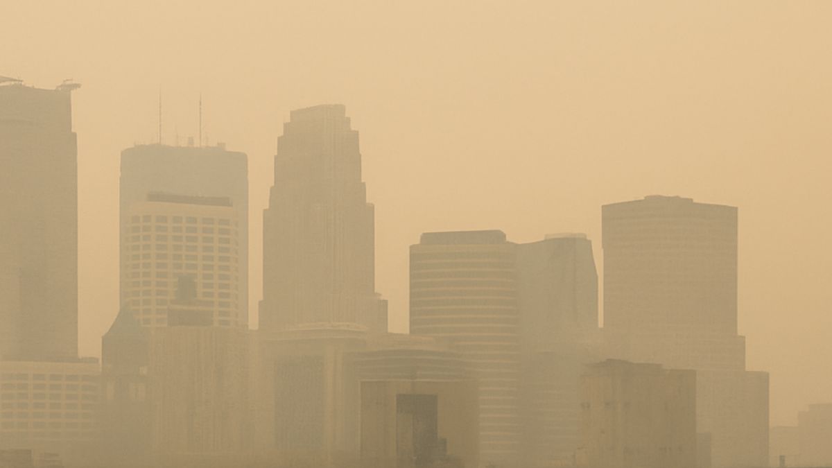 Hazy Minneapolis skyline with Canadian wildfire smoke on July 13, 2025