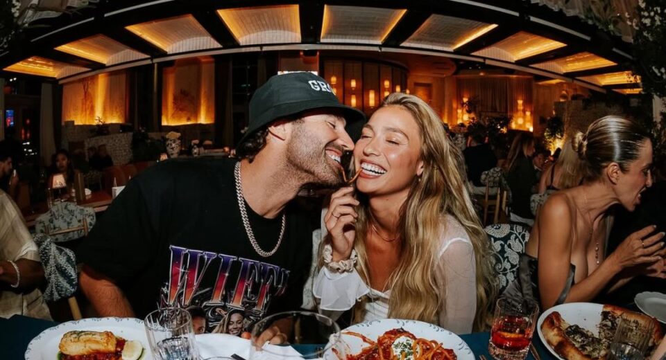 Brody Jenner and Tia Blanco laughing and sharing a meal at a romantic dinner