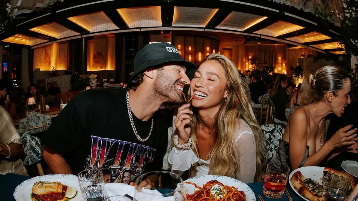 Brody Jenner and Tia Blanco laughing and sharing a meal at a romantic dinner