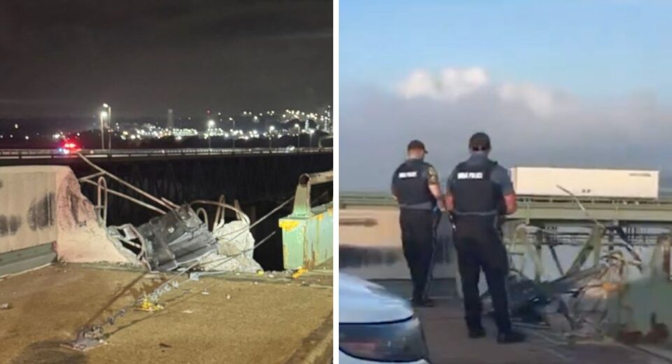 Damaged railing and rescue personnel on Delaware Memorial Bridge after tractor-trailer crash