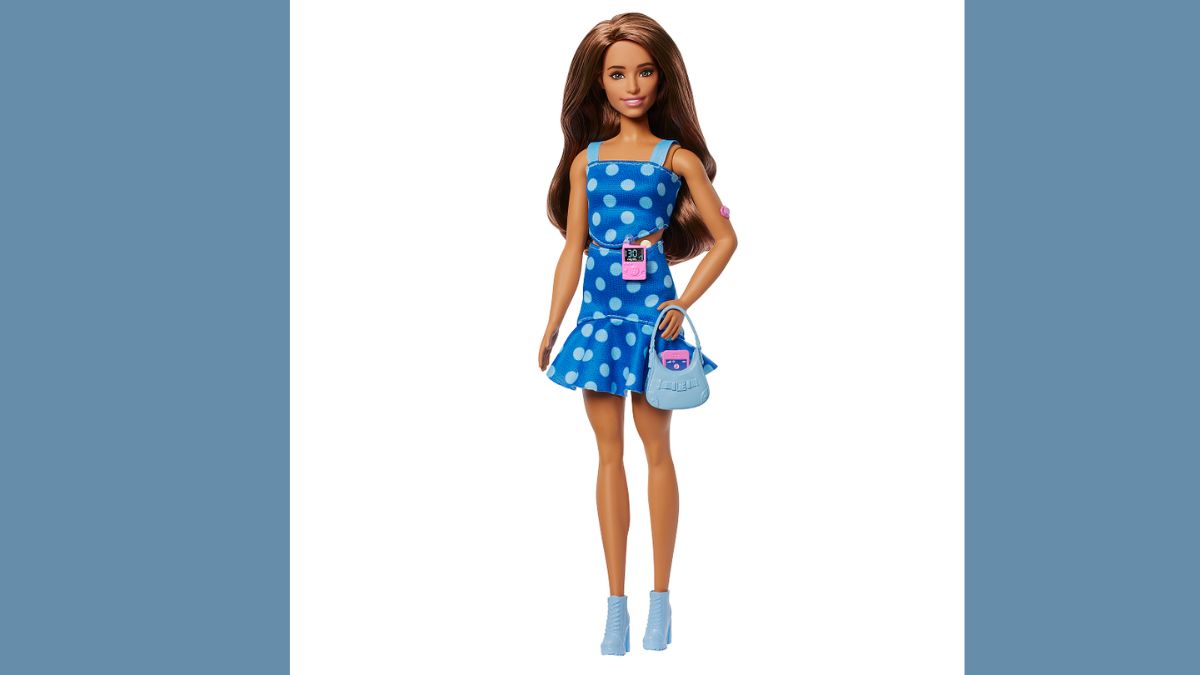 Full-body image of Barbie doll with Type 1 Diabetes wearing a blue polka-dot dress